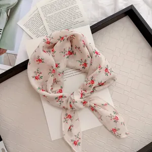 Detail of vintage floral cotton linen square scarf with red flowers on cream base