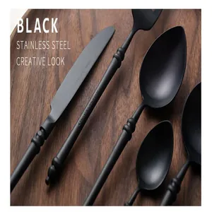 Close-up detail of black stainless steel cutlery with bamboo inspired handle design