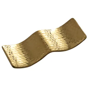 Elegant golden hammered stainless steel wave-shaped chopstick rest for dining tables