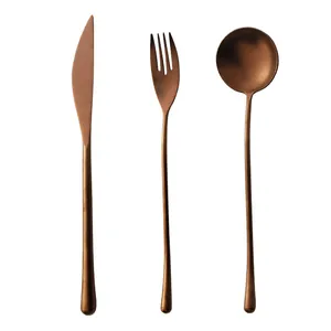 Vintage rose gold 304 stainless steel cutlery set including knife fork and spoon on white
