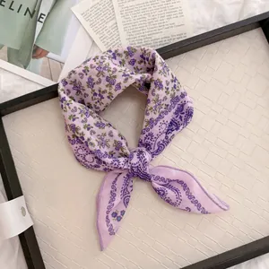 Close-up of a vintage purple floral and paisley cotton linen square scarf for hair decoration