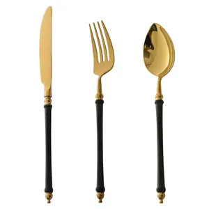 Elegant black and gold 304 stainless steel cutlery set with steak knife, fork, and spoon