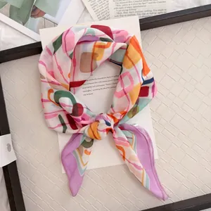 Close-up of a colorful abstract patterned cotton linen square scarf as a necktie