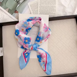 Detailed view of a vintage floral cotton linen square scarf with blue and pink patterns.