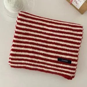Vintage red and white horizontal striped knitted winter scarf with brand tag detail view