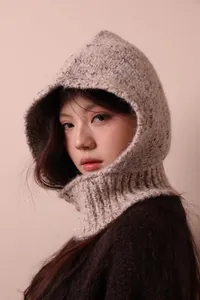 Close-up of a stylish marled knitted alpaca wool balaclava for cozy winter warmth