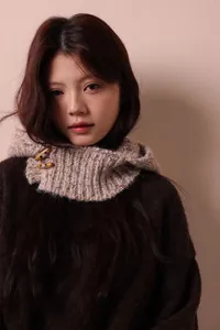 Cozy knitted hooded scarf with vintage toggle buttons for winter warmth and style