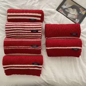 Macro detail of various red and white striped vintage knitted academy style scarves