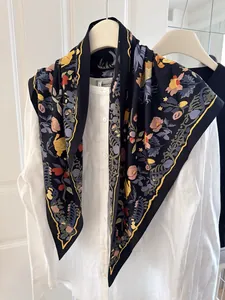 Floral printed triangle silk scarf styled over a white linen shirt for a chic feminine look