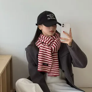 Vintage red and white striped knit scarf in academy style shown on an Asian model