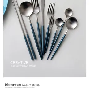 Close-up of blue and silver 304 stainless steel cutlery set with matte handles