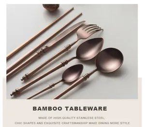 Close-up of rose gold stainless steel cutlery set with bamboo-inspired handles