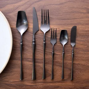 High-end 6-piece matte black brushed 304 stainless steel cutlery set on wooden background