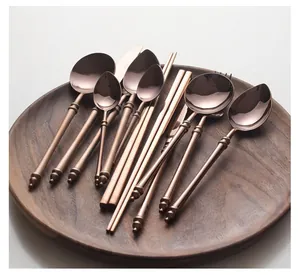Detail of rose gold stainless steel cutlery set with unique bamboo-inspired handles