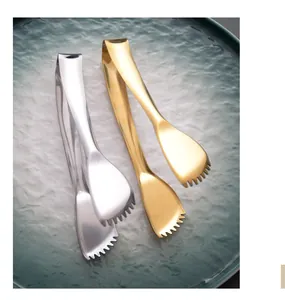 Detail view of 304 stainless steel food tongs in gold and silver with serrated edges