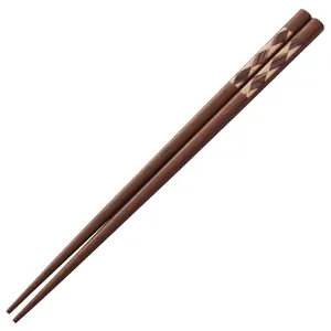 Japanese style wooden chopsticks with geometric diamond pattern on white background