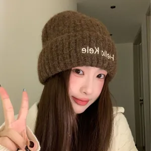Chic brown knitted beanie featuring soft texture and white Hello Kele embroidery detail