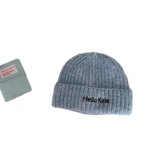 Warm light blue soft knitted beanie hat with Hello Kele embroidery for cold winter