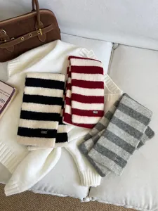 Soft striped knit neck warmer scarves in three colors for winter warmth.