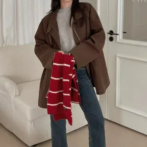 Red and white striped knit scarf for winter, showcasing soft texture and retro academy style.