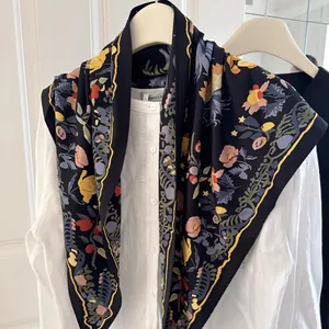 Floral printed silk scarf layered over a white linen shirt for a stylish spring look.