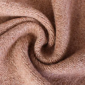 Macro detail of soft camel wool blend knit fabric texture for autumn winter shawl