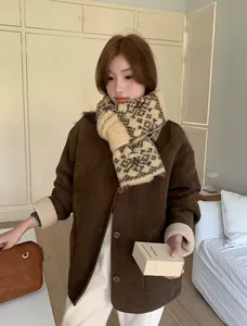 Detailed view of women's vintage snowflake jacquard knitted scarf for winter styling
