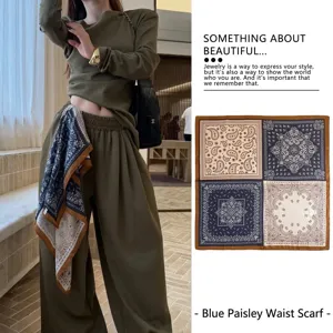 Vintage navy blue paisley print silk scarf styled as a chic waist belt accessory.