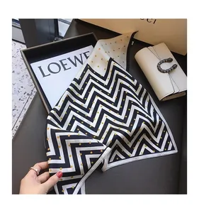 High-quality faux silk square scarf with classic black zigzag and gold polka dot patterns