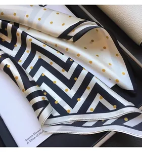 Elegant silk-like square scarf featuring black zigzag and yellow polka dot print