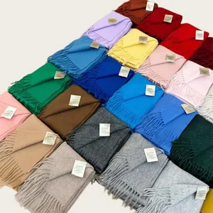 Detailed view of 100% wool scarves in various vibrant colors and soft texture