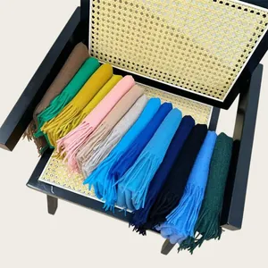 Assorted 100% wool scarves in vibrant colors neatly displayed for winter warmth