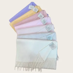 Selection of premium 100% Australian wool scarves in soft pastel shades with fringe