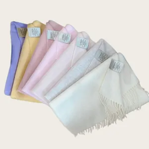 A variety of 100% Australian wool scarves in soft pastel colors with fringe details