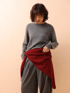 Red 100% Australian wool knitted triangle shawl worn as a chic styling accessory