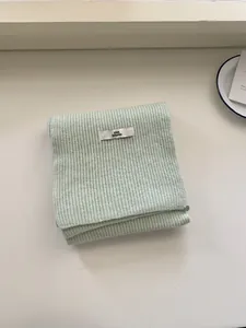 Soft minimalist light green rib-knit wool scarf for women, elegant winter accessory