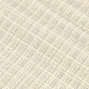 Détail macro de la texture d'un tissu bouclé tweed blanc cassé avec fils métalliques