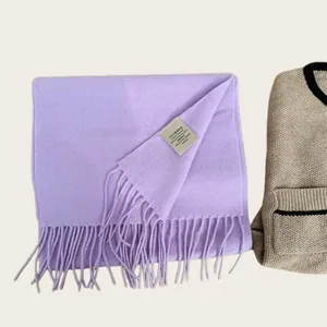High-quality close-up showing the 100% Australian wool label on a lavender scarf