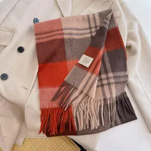 Detail of vintage pumpkin brown 100% Australian wool plaid scarf with tassels