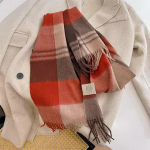 Close-up detail of the 100% Australian wool label on a vintage plaid tassel scarf