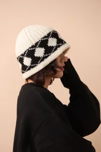 Close-up of a vintage black and white diamond knit wool bucket hat for women