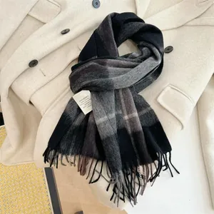 High-quality detailed view of 100% Australian wool plaid scarf with soft fringe edges