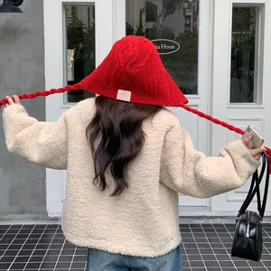 Trendy red knitted Lei Feng hat with long braids for winter warmth and ear protection