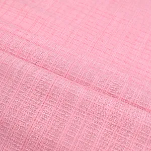 Detailed macro view of pink tweed fabric texture featuring a classic plaid pattern weave