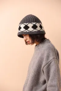 Nordic vintage grey wool knit bucket hat with black and white argyle pattern on model
