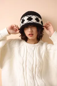 Detailed macro view showing the vintage Nordic pattern on a thickened wool knit bucket hat