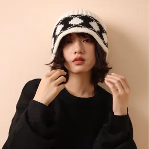 Asian model wearing a stylish 100% wool vintage rhombus pattern knit beanie in black and white