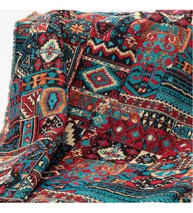 Detailed macro shot of premium bohemian jacquard fabric featuring vintage ethnic patterns