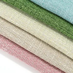 Close-up of multicolored textured tweed fabric swatches with metallic silver threads