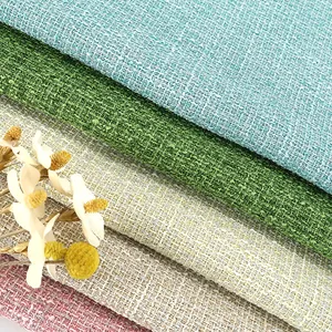 Macro close-up of colorful tweed fabric showing textured weave and silver threads